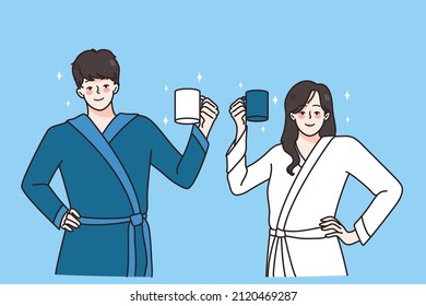 Happy young couple in bathrobes hold mugs drinking coffee in morning welcome new day. Smiling man and woman with cups have breakfast at home together. Habit concept. Vector illustration. 