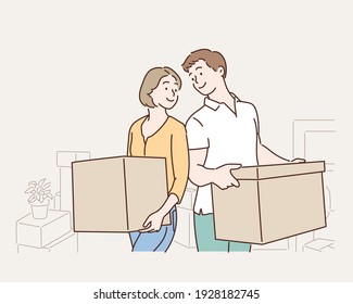 Happy young couple with cardboard boxes in their new house. Hand drawn style vector design illustrations.