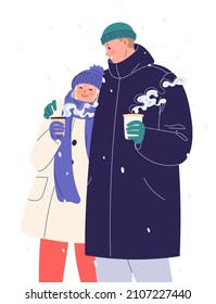 Happy young couple walking in winter and drinking coffee