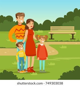 Happy young family spending time in city park