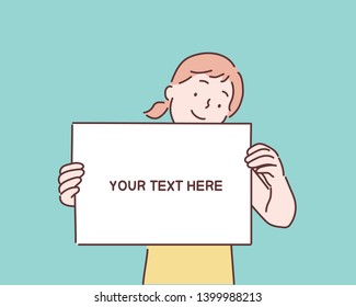 Happy young girl holding/showing/displaying white blank board/banner/poster.Hand drawn style vector design illustrations.