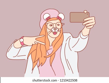 Happy young girl taking selfie