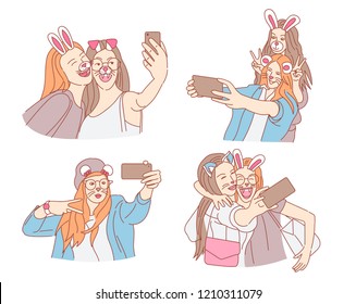 Happy young girls taking selfie