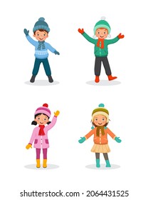 Happy young kids wearing warm winter clothes smiling and waving hands.