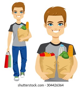 Happy young man carrying grocery paper bag full of healthy vegetables and other food and drinks