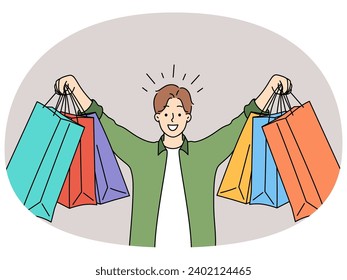 Happy young man holding shopping bag buying on sales. Smiling guy show numerous parcels purchase things on promotion. Consumerism and shopaholic. Vector illustration.