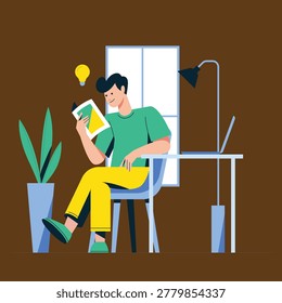 Happy young man reading a book while sitting in a cozy home offi