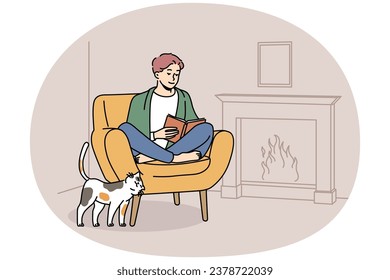 Happy young man sit in chair at home near fireplace reading book. Smiling guy relax in armchair enjoying literature. Hygge and domestic weekend. Vector illustration.