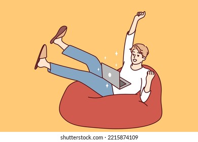 Happy young man sit on sofa triumph win lottery online on computer. Excited guy use laptop feel euphoric with good news online on victory. Vector illustration. 