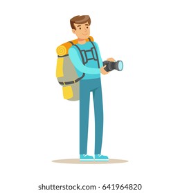 Happy young man standing with backpack and holding flashlight. Colorful cartoon character vector Illustration