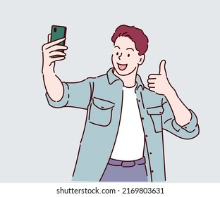 Happy young man standing smile, holding mobile phone him taking selfie. Hand drawn in thin line style, vector illustrations.