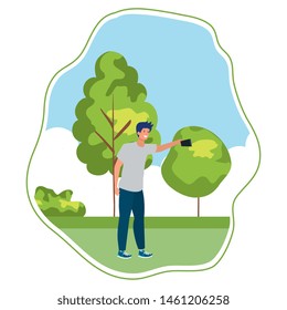happy young man taking a selfie in the park