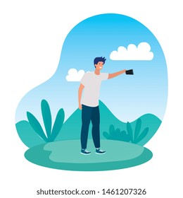 happy young man taking a selfie in the park