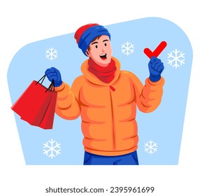 Happy young man in winter clothes holding check mark and shopping bags