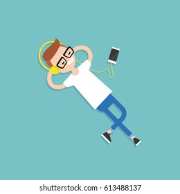 Happy young nerd with headphones listening to music on a floor. Top view / flat editable vector illustration