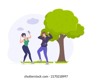 Happy young people in sports outfit listening music. Cheerful man and woman enjoying music wearing headphones and dancing. People enjoying leisure time or doing morning exercises in park flat vector