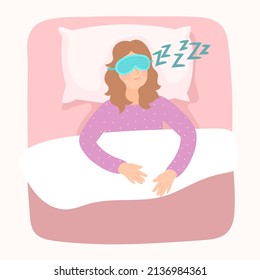 Happy young woman in blindfold eye mask on face sleeping in bed.
