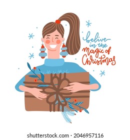 Happy young woman carrying huge christmas gifts box. Girl with bauble earings holding her holiday present. Female cartoon characeter gives or gets presents at christmas party. Flat vector design