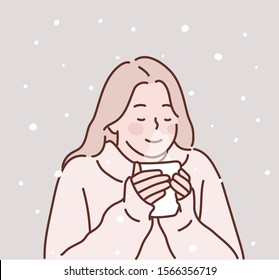 Happy young woman with a cup of hot tea on snowy winter. Hand drawn style vector design illustrations.