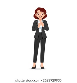 Happy young woman in formal suit clapping her hands with joyful expression and looking at the camera