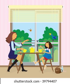 Happy young woman and her little pre-school daughter are sitting opposite each other and eating cakes near the balcony at their home.