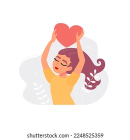 Happy young woman holding a heart above her head. Concept of acceptance and self love. Positive psychology, optimism and mental health.