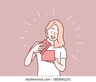 Happy young woman opening a  present box. Hand drawn style vector design illustrations.