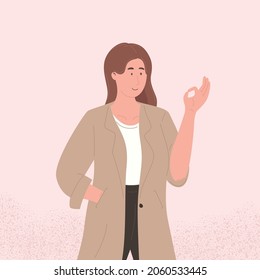 Happy young woman raises her hand with sign ok