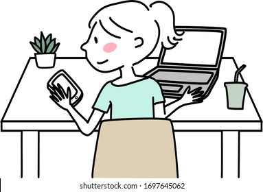 Happy young woman sitting at desk, staring at mobile phone screen while using computer doing work. Cute young woman sitting at desk with laptop and reading message or video call on smartphone.