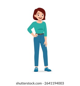 Happy young woman standing with hand on hip, wearing casual clothes, smiling expression