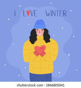 Happy young woman in winter jacket and hat folded her hands in mittens in shape of heart and enjoys snowfall. Postcard with inscription. I love winter. Flat vector illustration