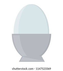 
A hard boiled egg in egg cup for healthy breakfast 
