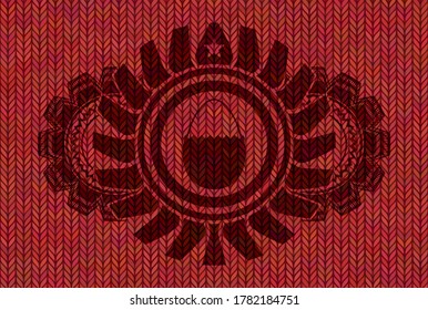 Hartgekochtes Ei-Symbol in rotem Wollstoff-Emblem. Stoff auf würdevollem Hintergrund. Intensive Illustration. 