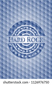 Hard Rock blue emblem or badge with abstract geometric pattern background.