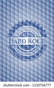 Hard Rock blue emblem with geometric background.