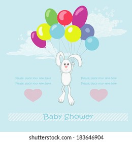 Hare with balloons in blue sky