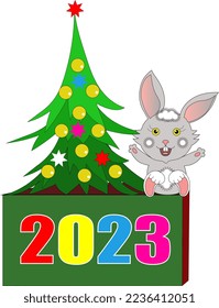 The hare symbol of the new year 2023 sits under the Christmas tree