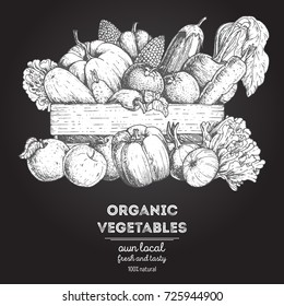 Harvest of vegetables in the box.  Hand drawn black and white vector illustration. Engraved style.