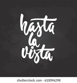 Hasta la vista - hand drawn spanish lettering phrase, that means See you on the black chalkboard background. Fun brush ink inscription for photo overlays, greeting card or print, poster design