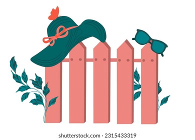 Hat with glasses on the fence. Summer, spring. Good weather