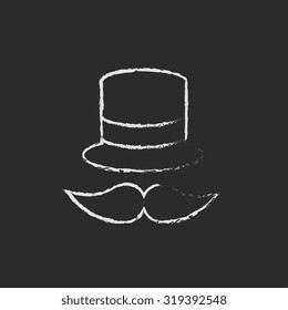 Hat and mustache hand drawn in chalk on a blackboard vector white icon isolated on a black background.
