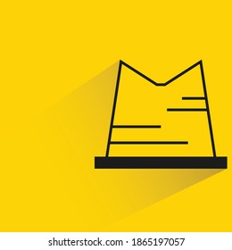 hat with shadow on yellow background