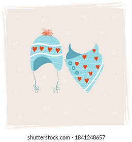 Sombrero con corbatas con pompa roja y pañuelo de punto hecho de hilo caliente. Set de ropa de punto caliente para la temporada fría. Accesorios de invierno de estilo escandinavo en suaves colores azules y corazones rojos. 