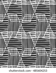 Hatched trapezoids white on black overlapping.Hand drawn with ink seamless background.