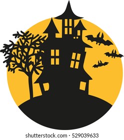 Haunted house with bats and moon