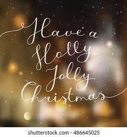 have a holly jolly christmas, vector lettering, handwritten text on blurred winter background with snowfall