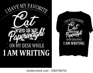 I have my favorite cat, who is my paperweight, on my desk while I am writing - t shirt design 