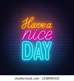 Have a Nice Day neon lettering on brick wall background.