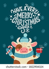 Have a very Merry Christmas. Bull in a hat with a gift. Great lettering for greeting cards, stickers, banners, prints and home interior decor. Xmas card. Merry Christmas and Happy new year 2021