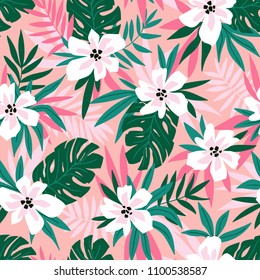 Hawaiian seamless pattern with pink flowers and green leaves. Stylish floral endless print for summer fabric design. Vector illustration.